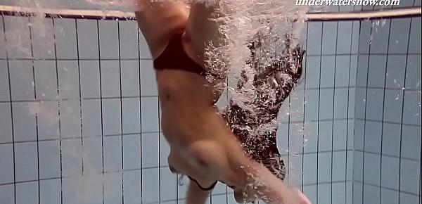  Paulinka underwater stripping babe
